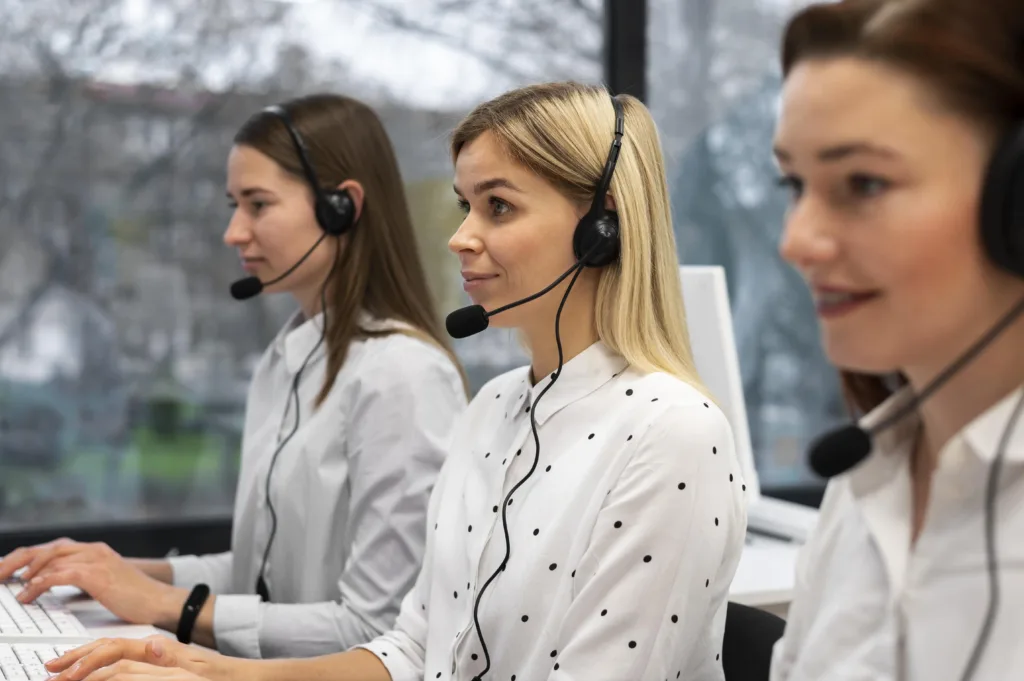 Colleagues Working Together Call Center With Headphones Min